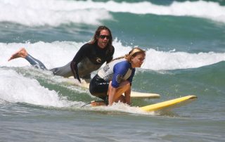 surf lesson private stand up on wave